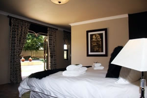 Relax in stunning formal gardens around the outdoor pool at Accolades Accommodation and Wedding Venues in Midrand