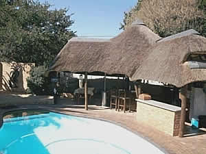 Gym, pool table and bar at Morning, Noon & Night bed and breakfast accommodation in Alberton