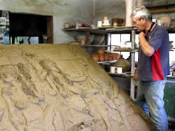 Chris Patton , potter, busy with wine cellar mural